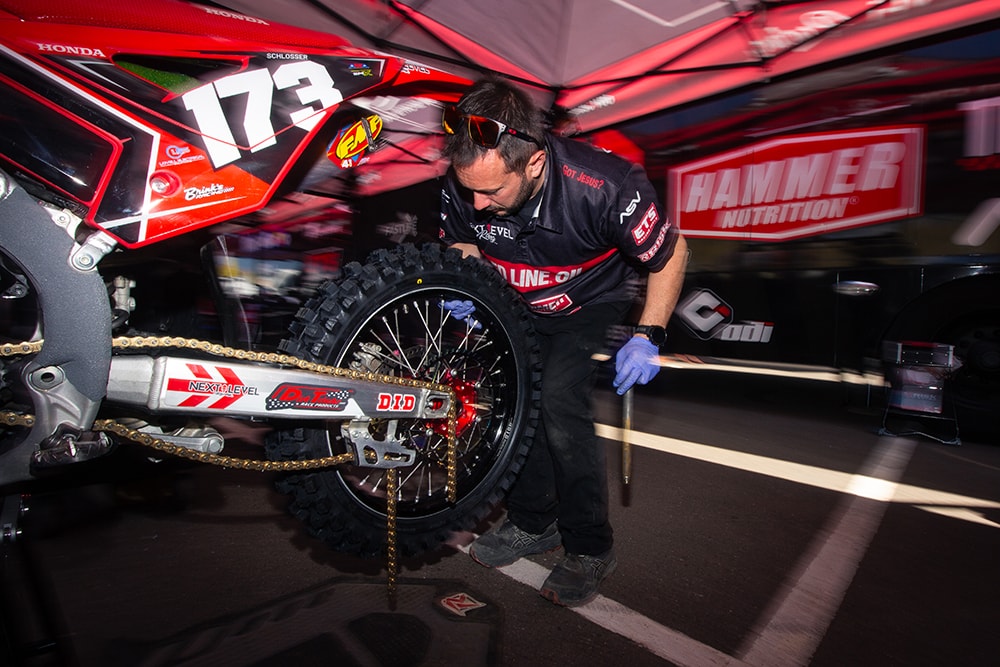 Next Level Racing mechanic working on bike